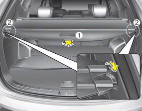 1. Pull the cargo security screen towards the rear of the vehicle by the handle